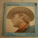 Buy vinyl record HALLYDAY JOHNNY LA TERRE PROMISE + 12 - AVEC CADRE BLEU UNI - 1975 for sale