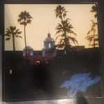 Buy vinyl record THE EAGLES + poster Hotel California for sale